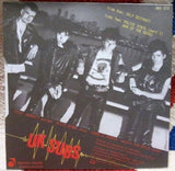 UK Subs - Shake Up The City 7" Record (Red Colored Vinyl)